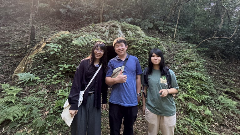 Three staff members smiling at the camera in the forest, for Nature Valley Environmental Charity Trust Taiwan